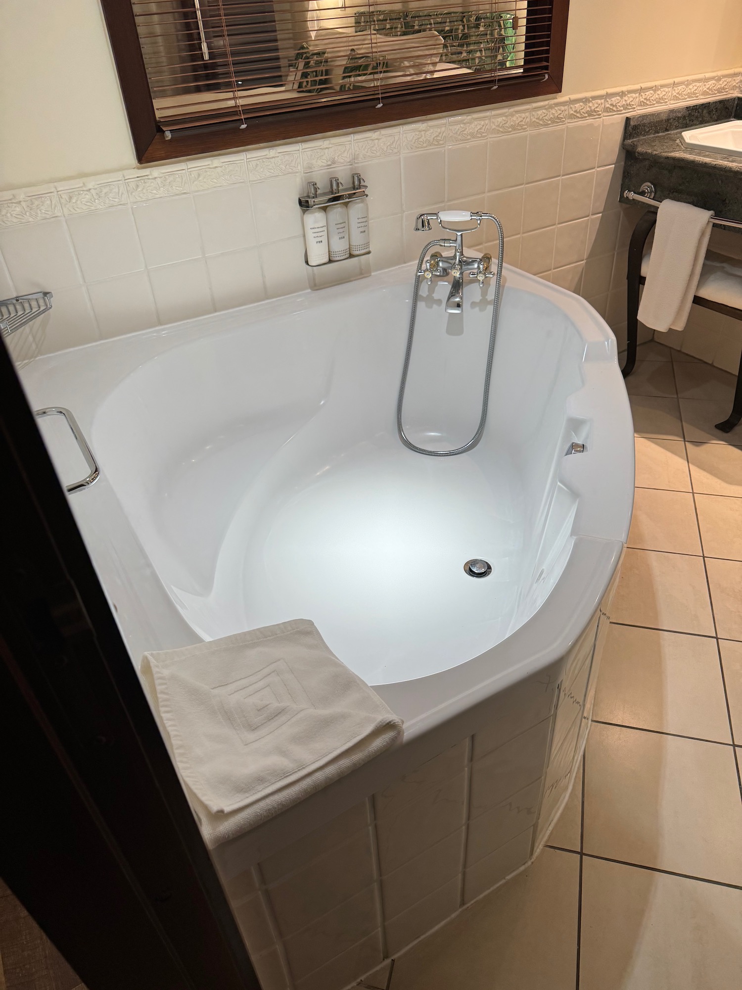 a white bathtub in a bathroom