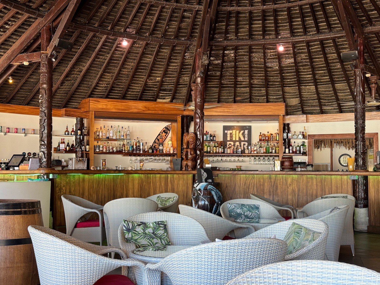 a bar with a lounge area and chairs