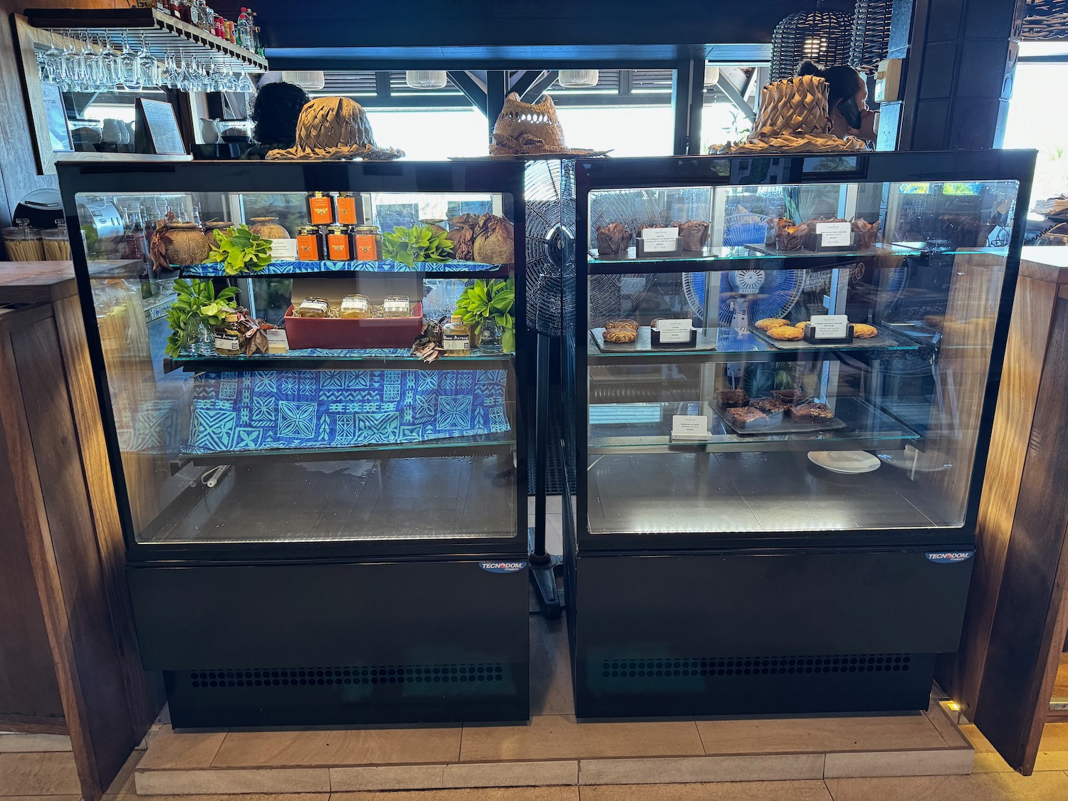 a glass cases with food on them