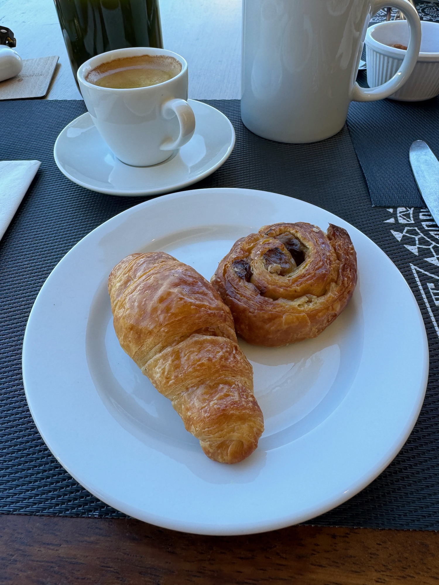 a plate of food and a cup of coffee