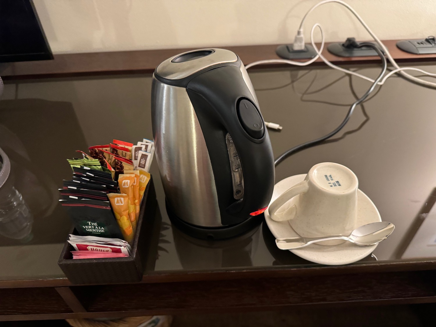 a teapot and teacup on a table