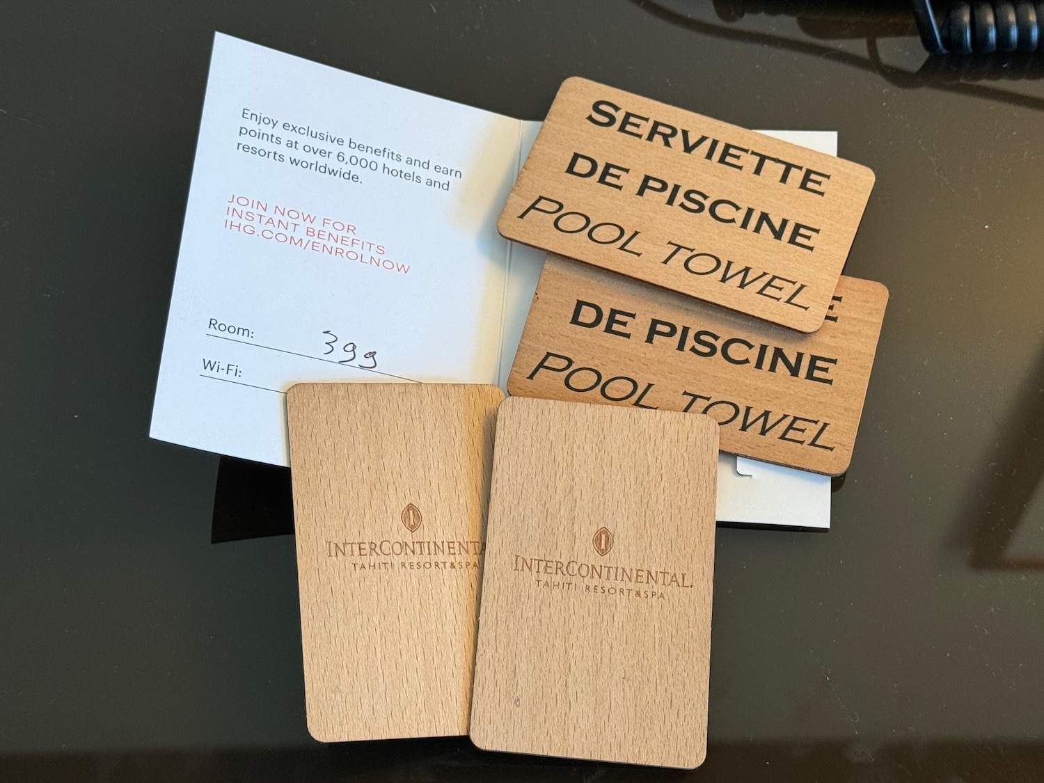 a group of wooden cards with a receipt