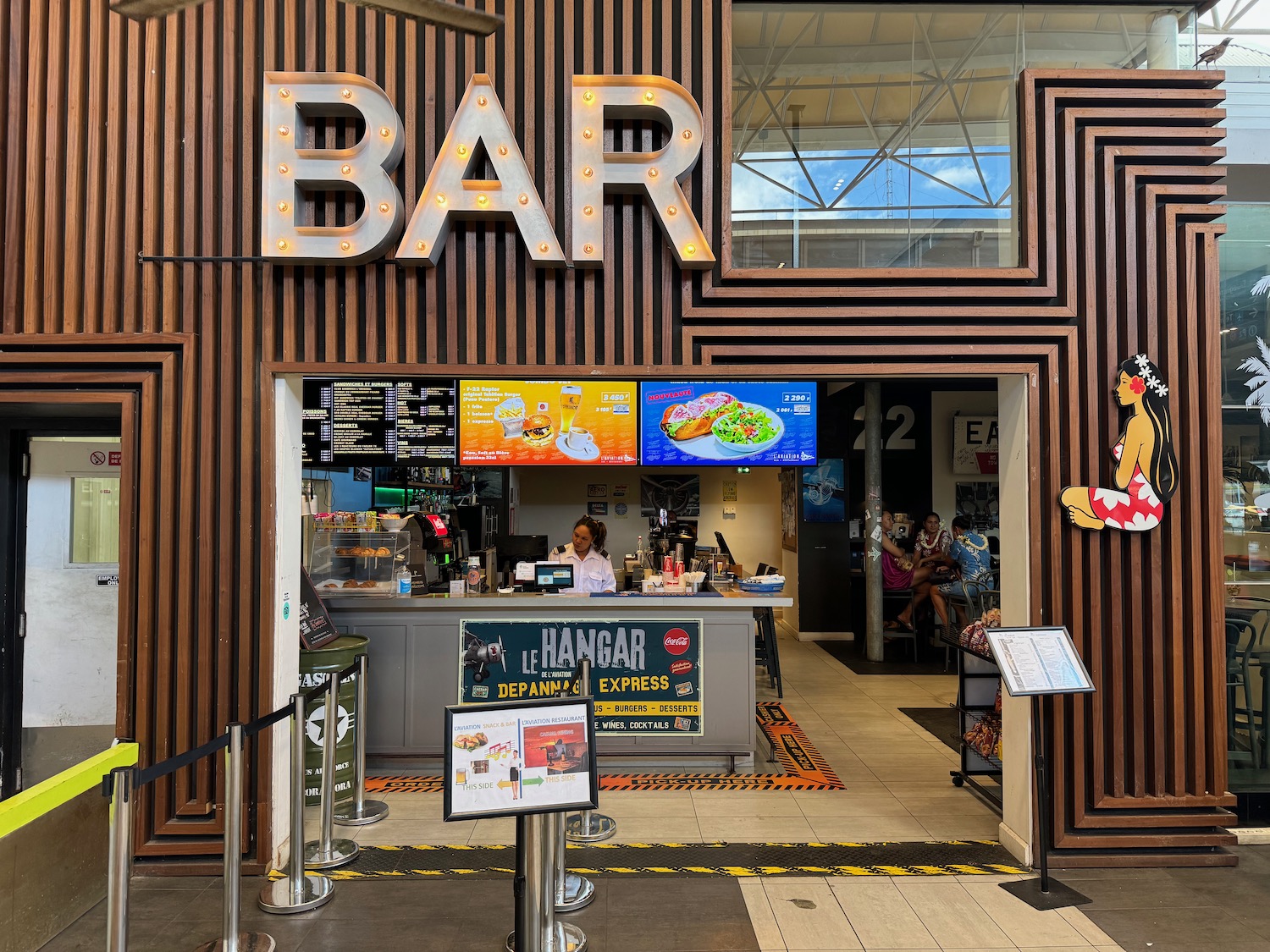 a bar with lights on the wall