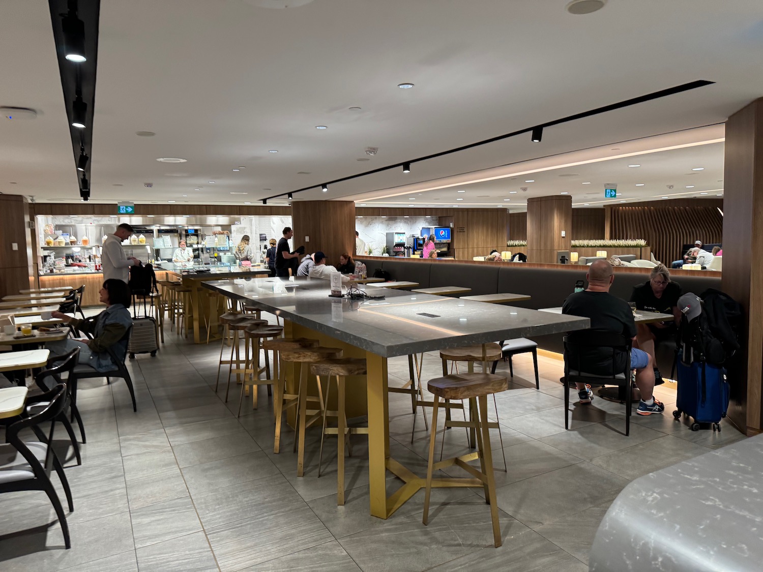 a large bar with people sitting at tables