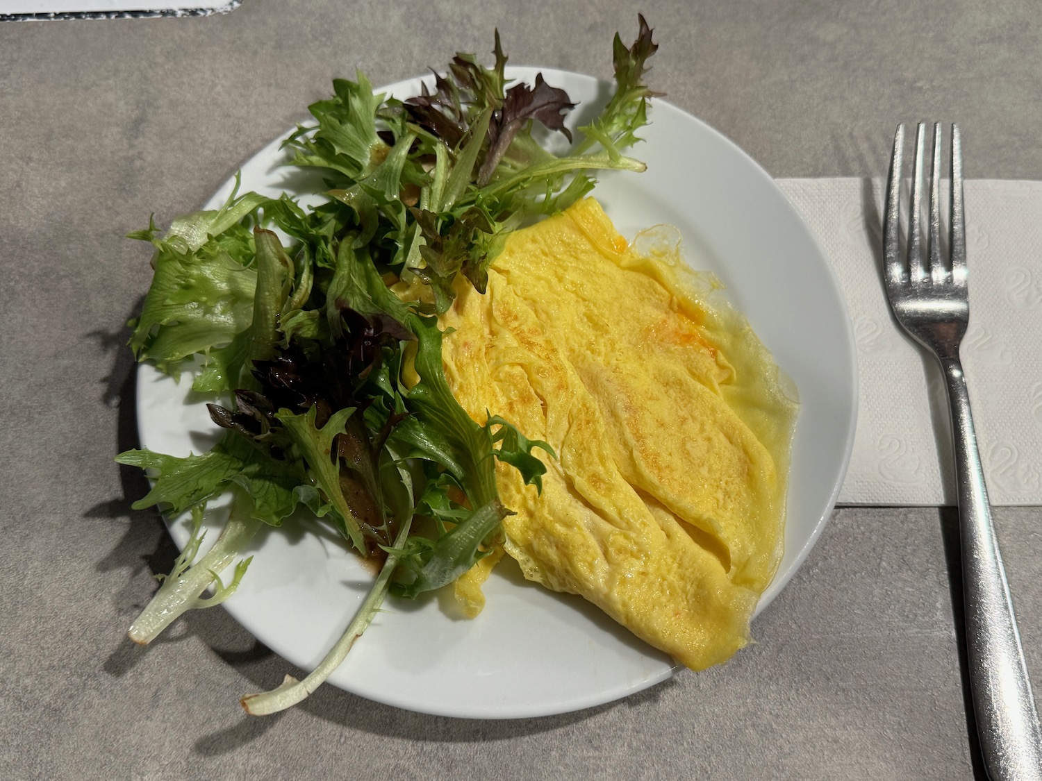 a plate of food with a fork and knife