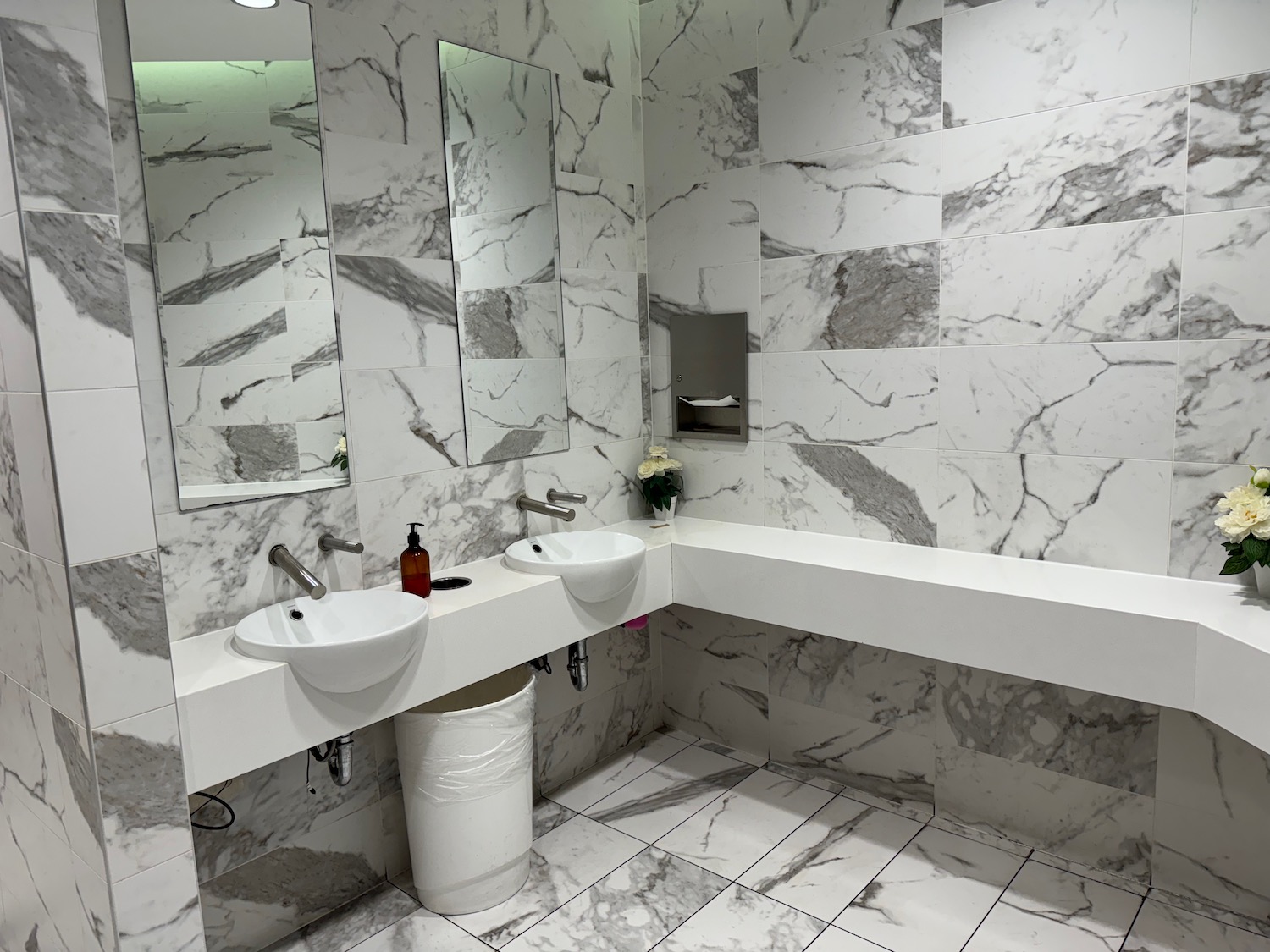 a bathroom with marble tiles