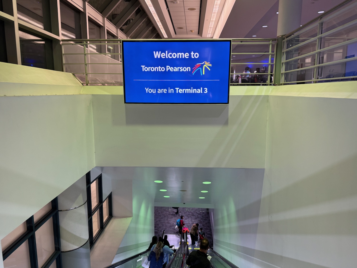 a sign on a escalator