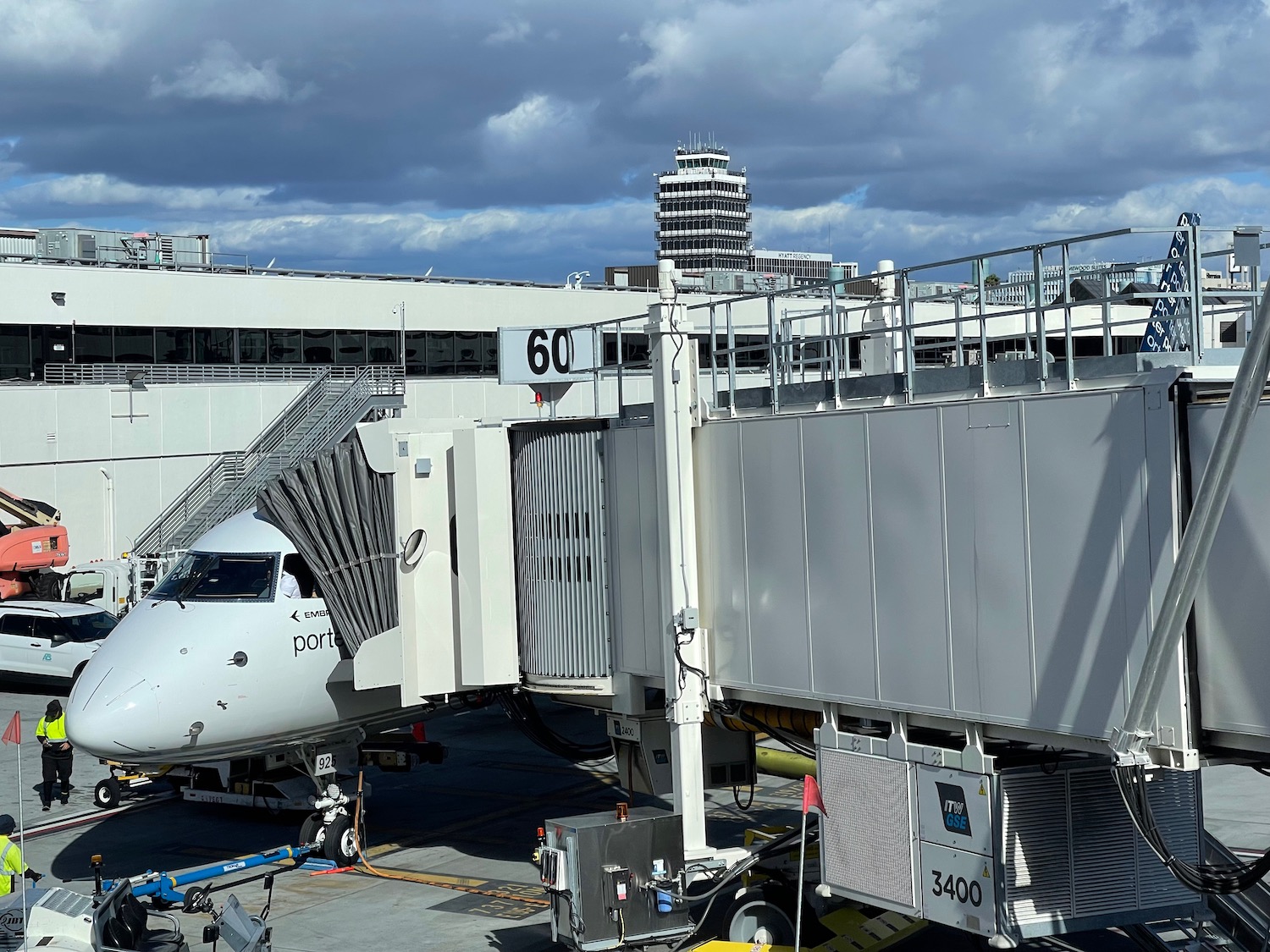 a plane boarding at an airport