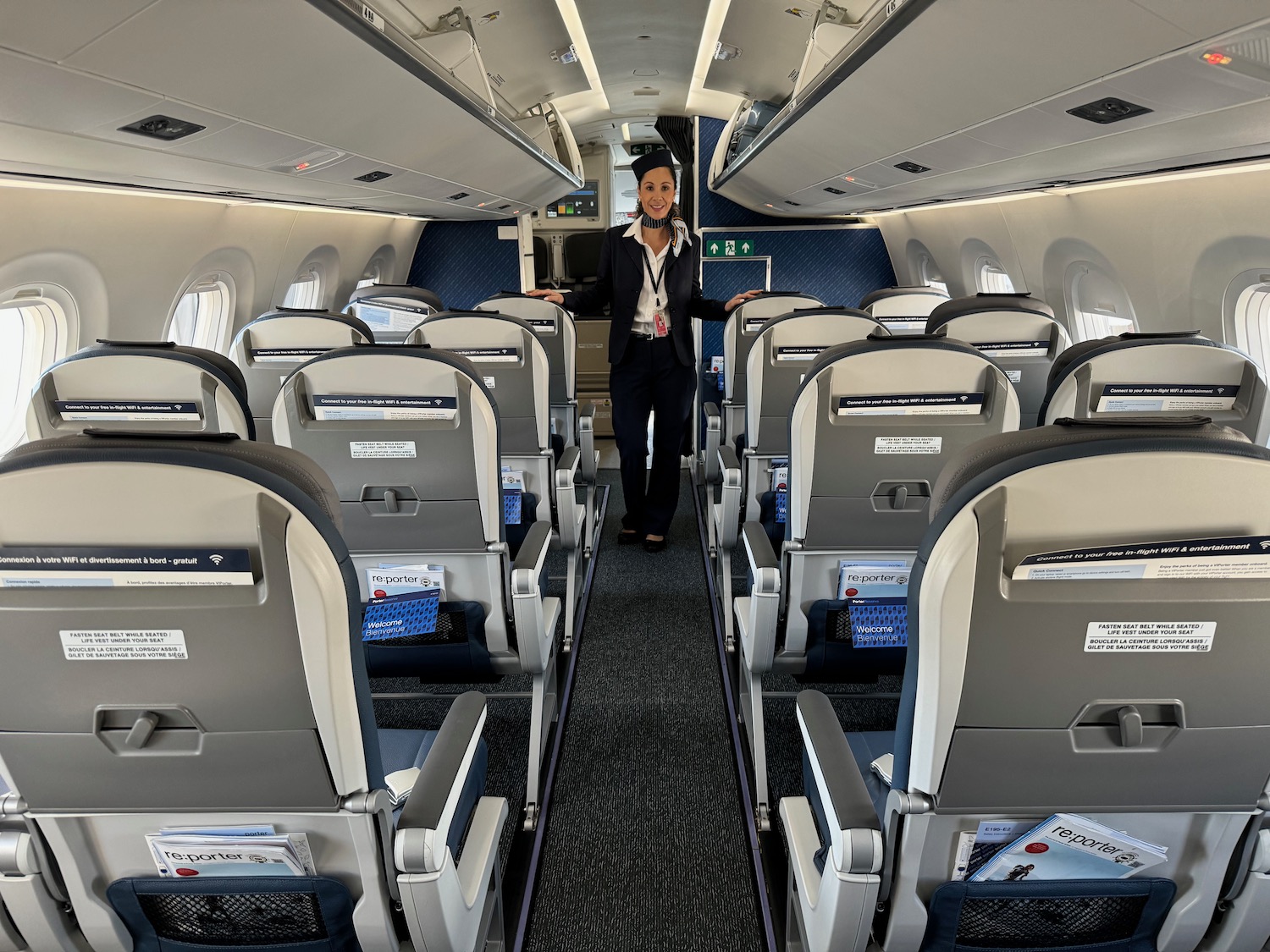 a woman standing in an airplane