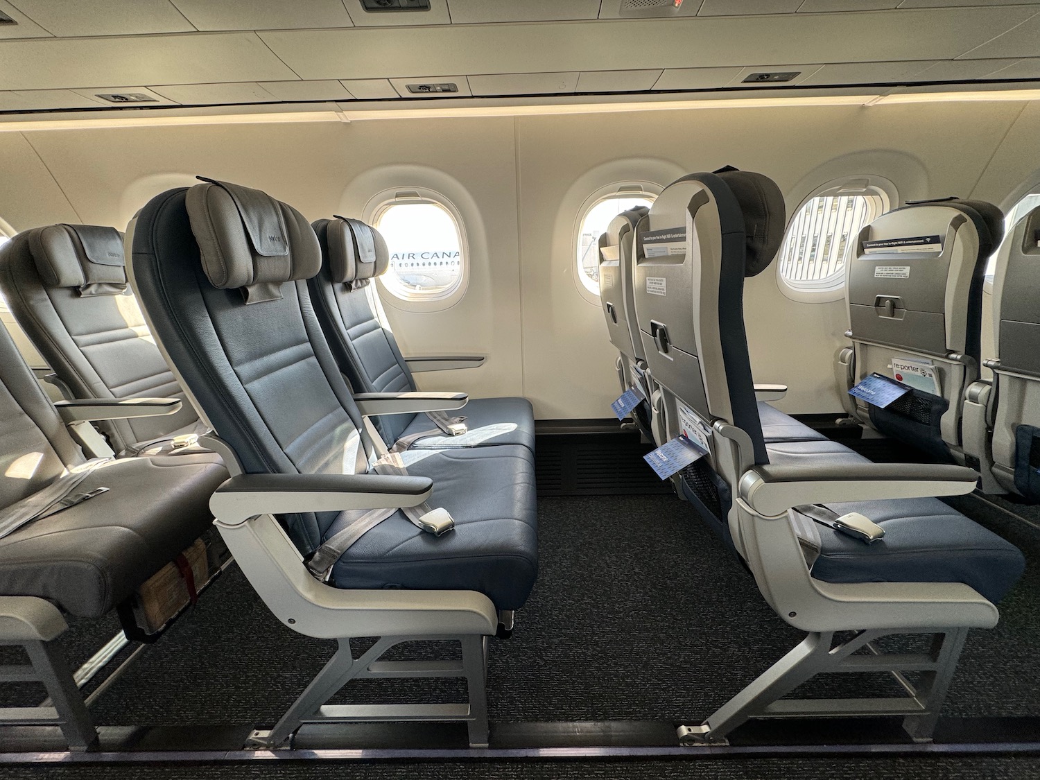 seats in an airplane with round windows