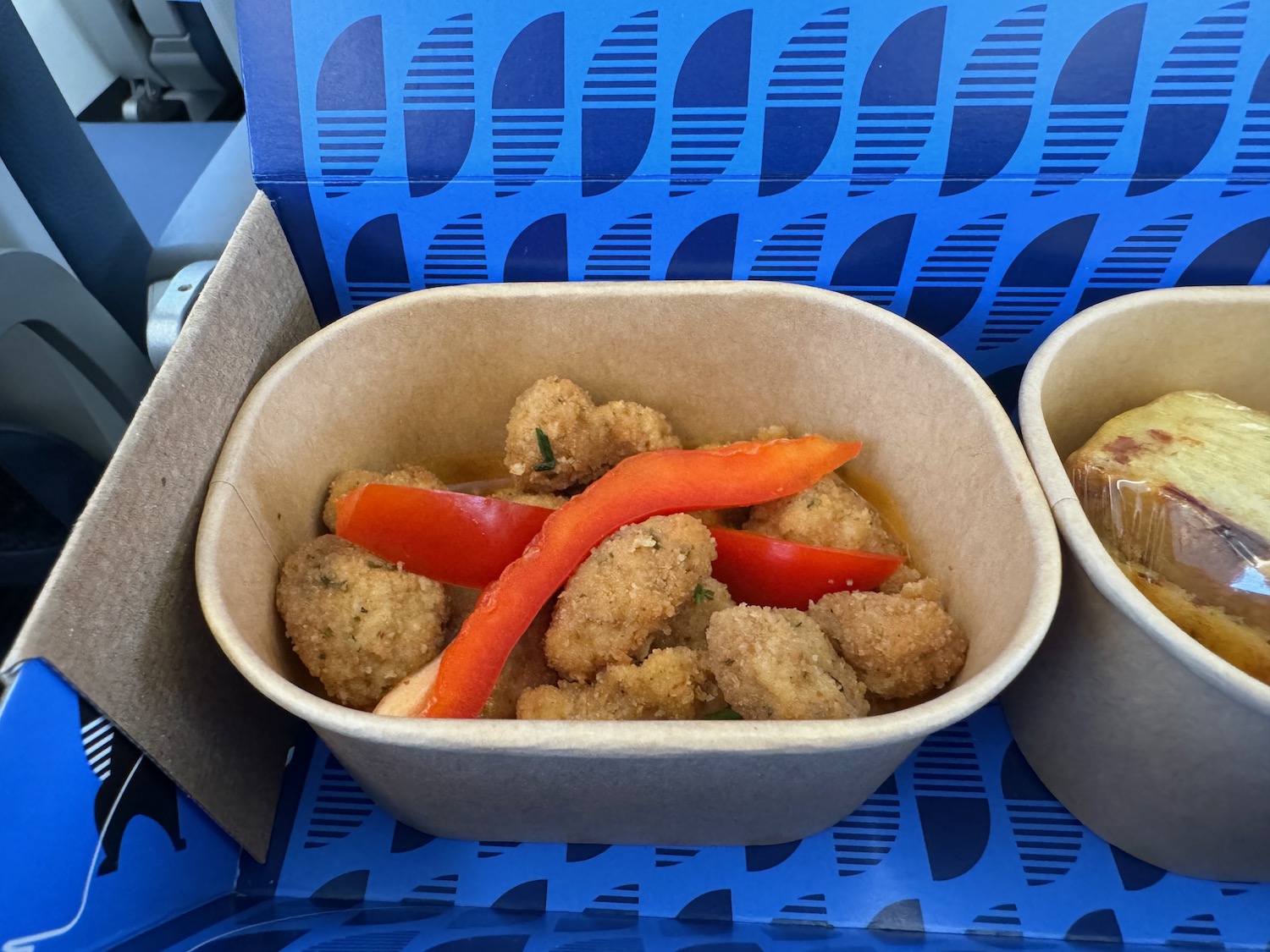 food in a container on a tray