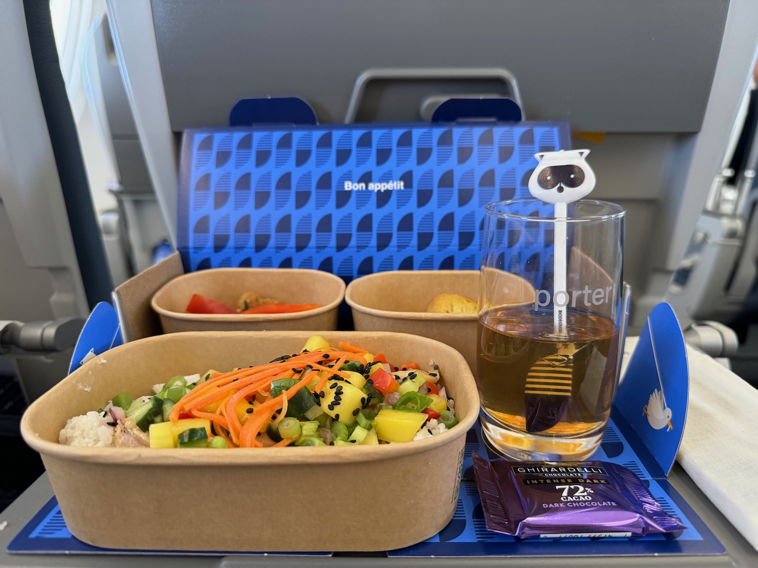 a food in a container on a tray