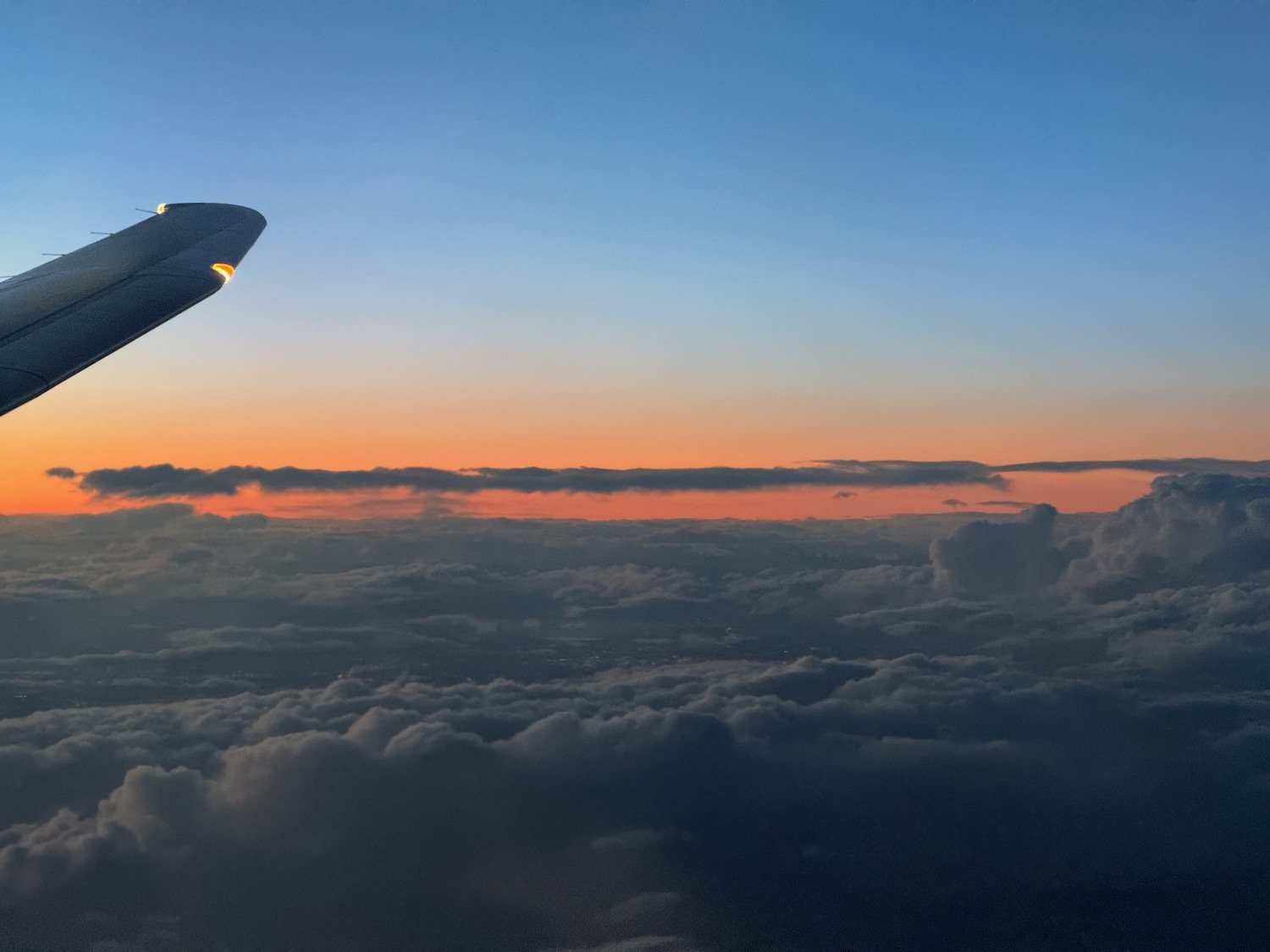 an airplane wing in the sky