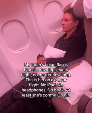 a woman sitting in a plane