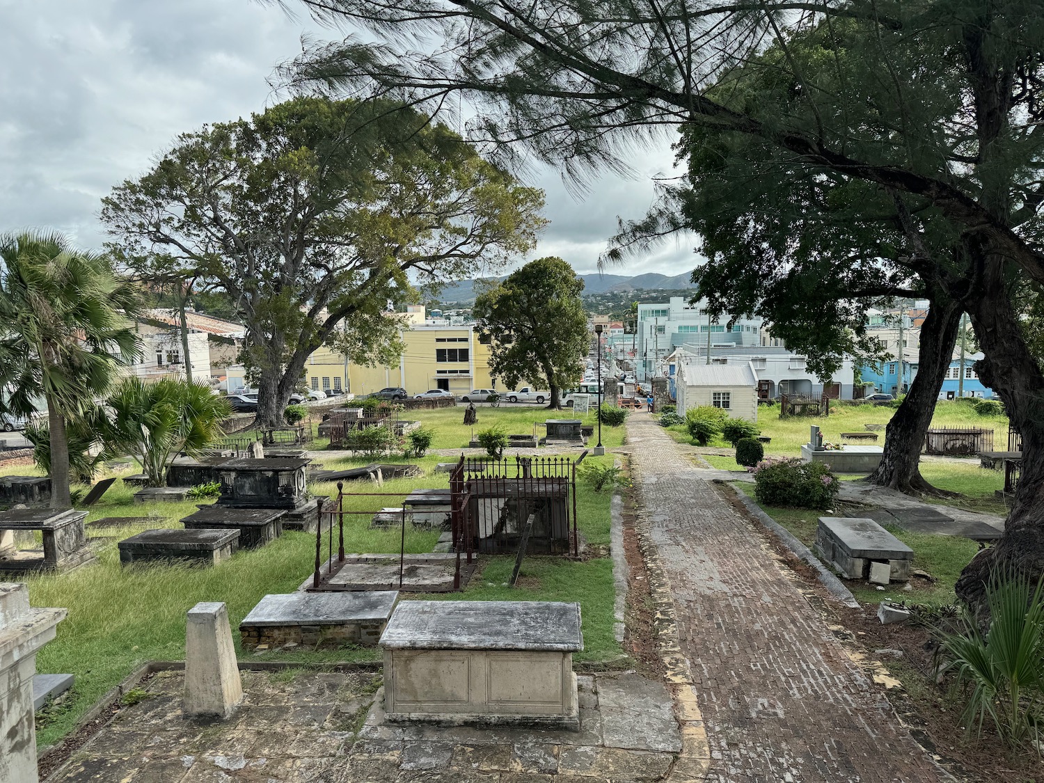 a cemetery with trees and buildings