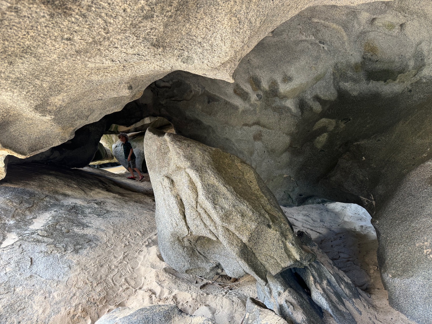 a person standing in a cave