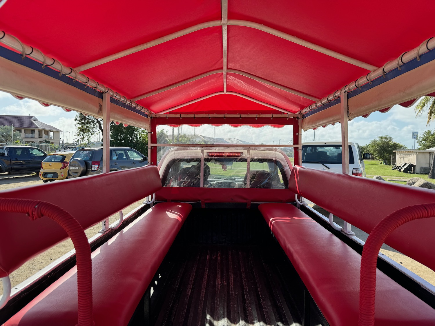 the back of a truck with red seats