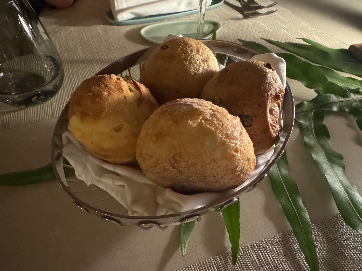 a bowl of bread on a table