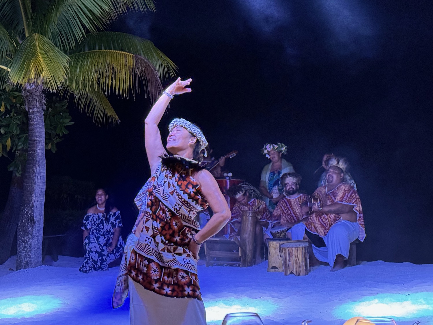 a woman dancing on a beach