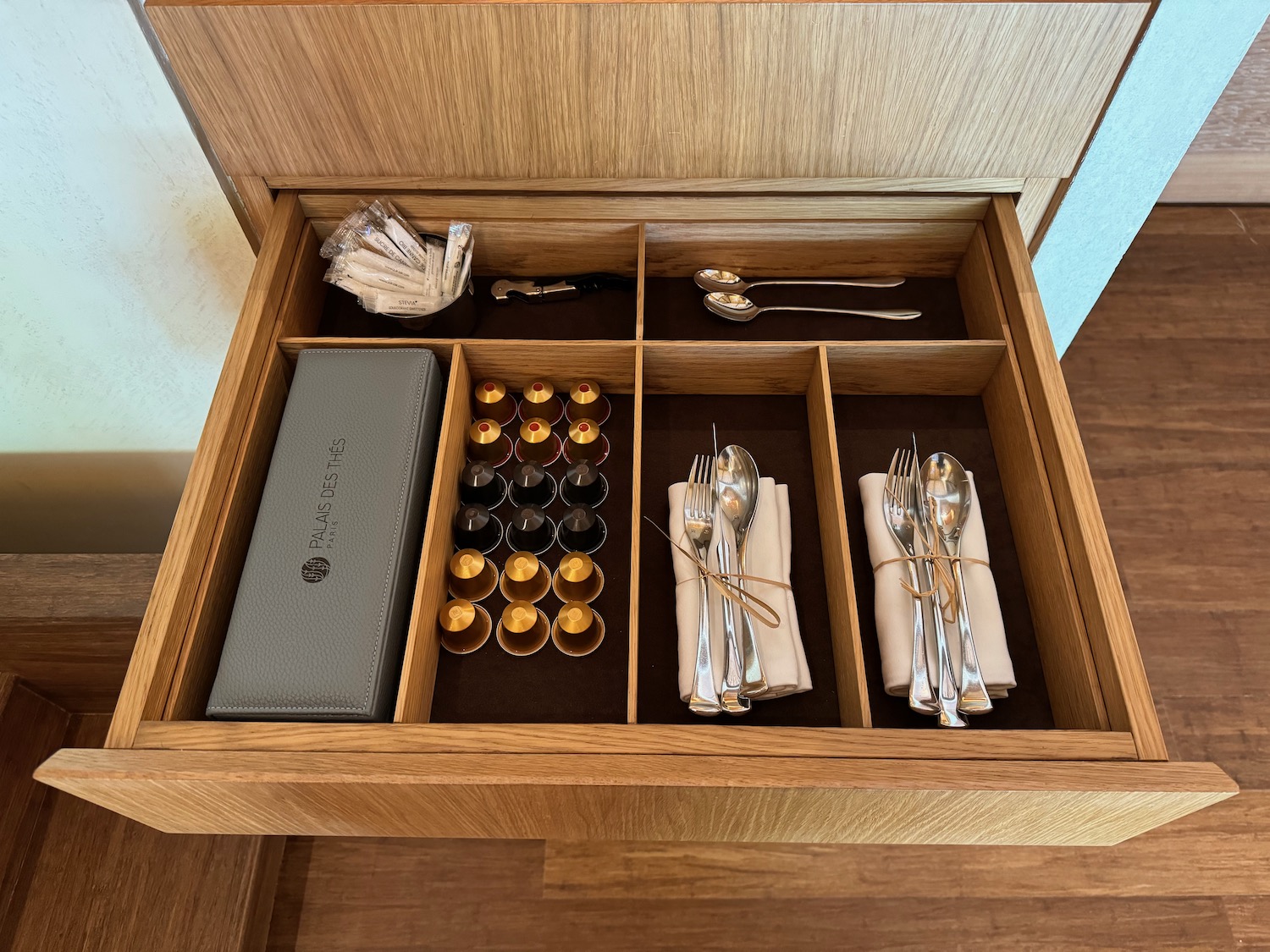 a drawer with silverware and silverware in it