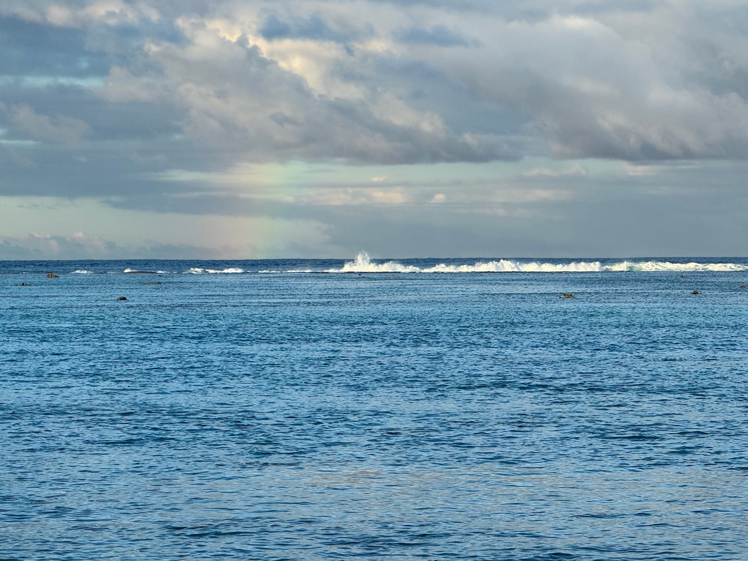 a body of water with waves in the distance