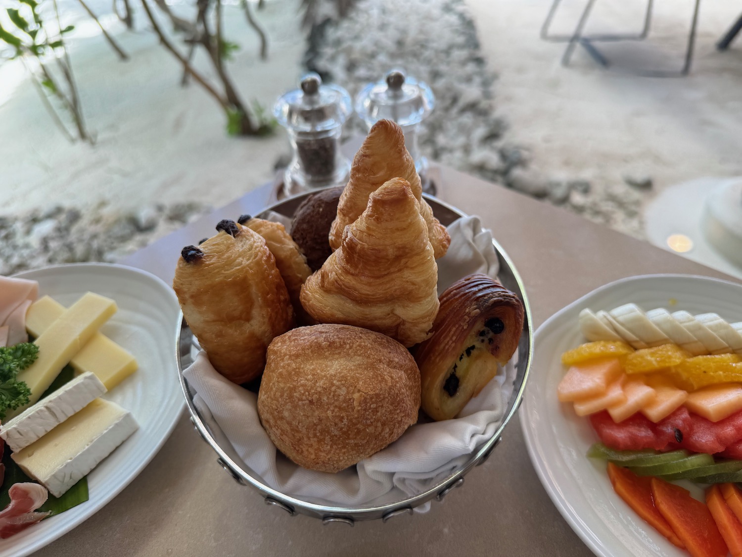 a bowl of pastries and fruit