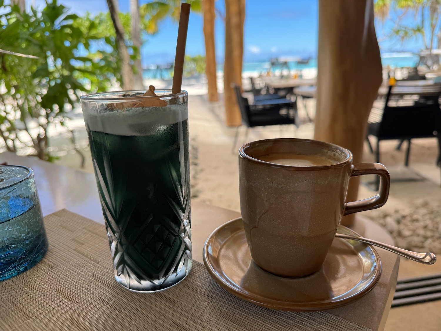 a cup of coffee and a drink on a table