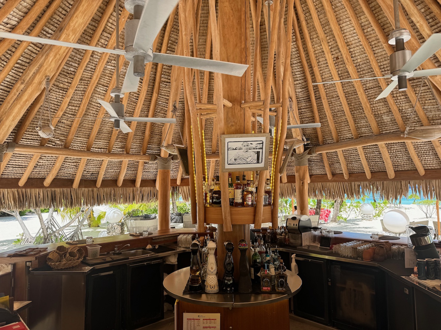 a bar with a table and a fan