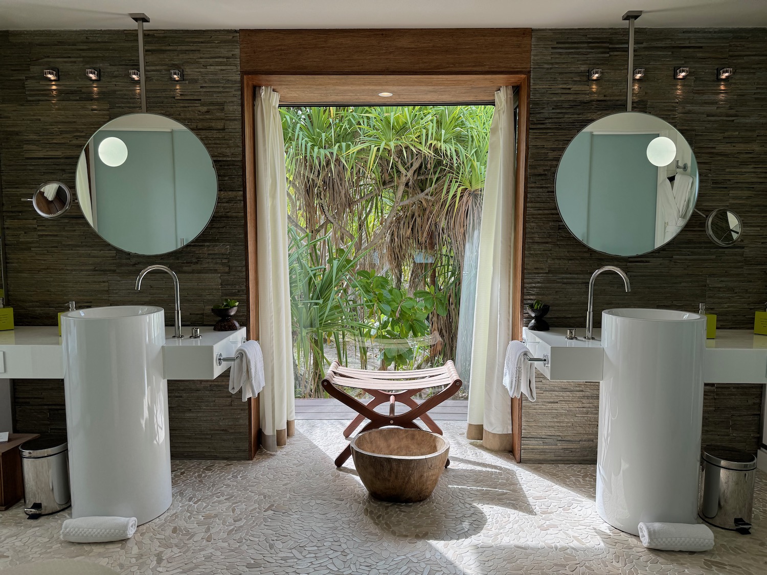 a bathroom with sinks and mirrors