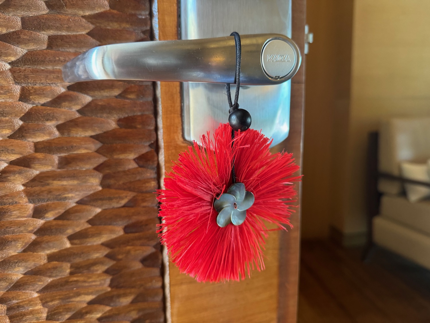 a red flower on a door handle