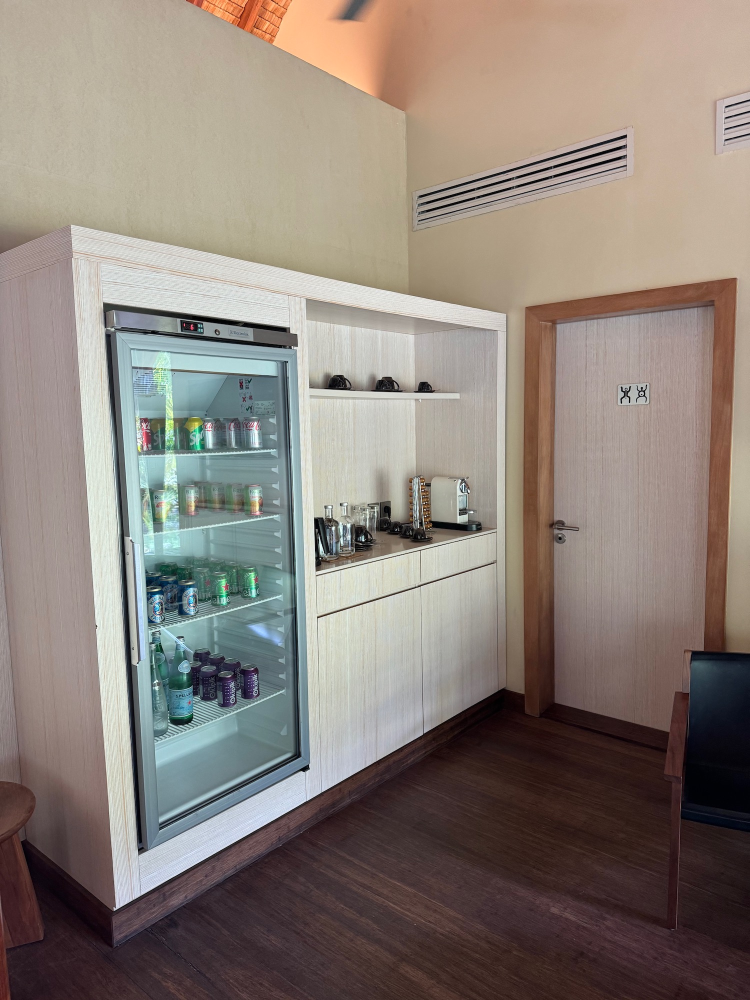a room with a refrigerator and a door