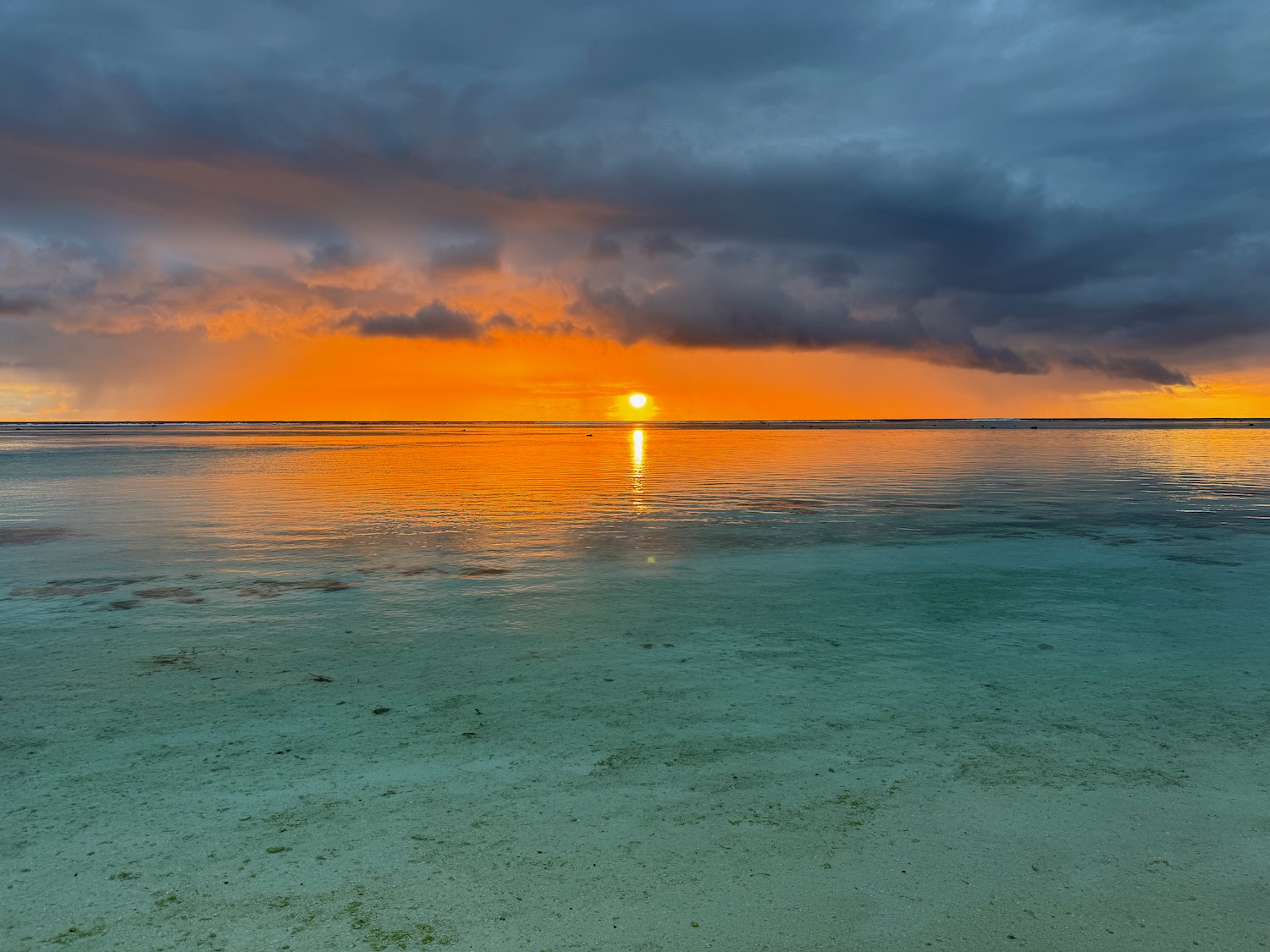 a sunset over a body of water