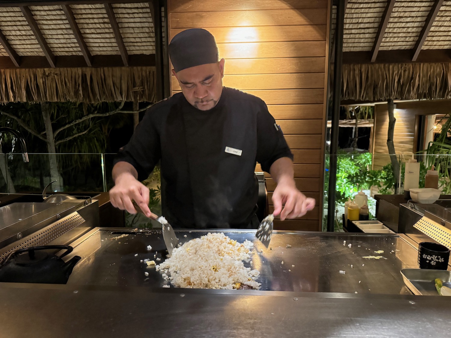 a man cooking food on a grill