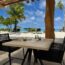 a table and chairs on a beach