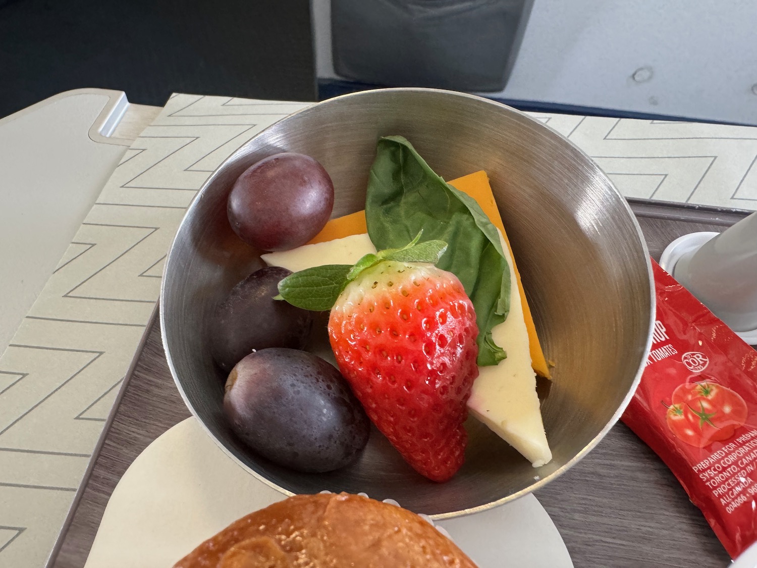 a bowl of fruit and cheese