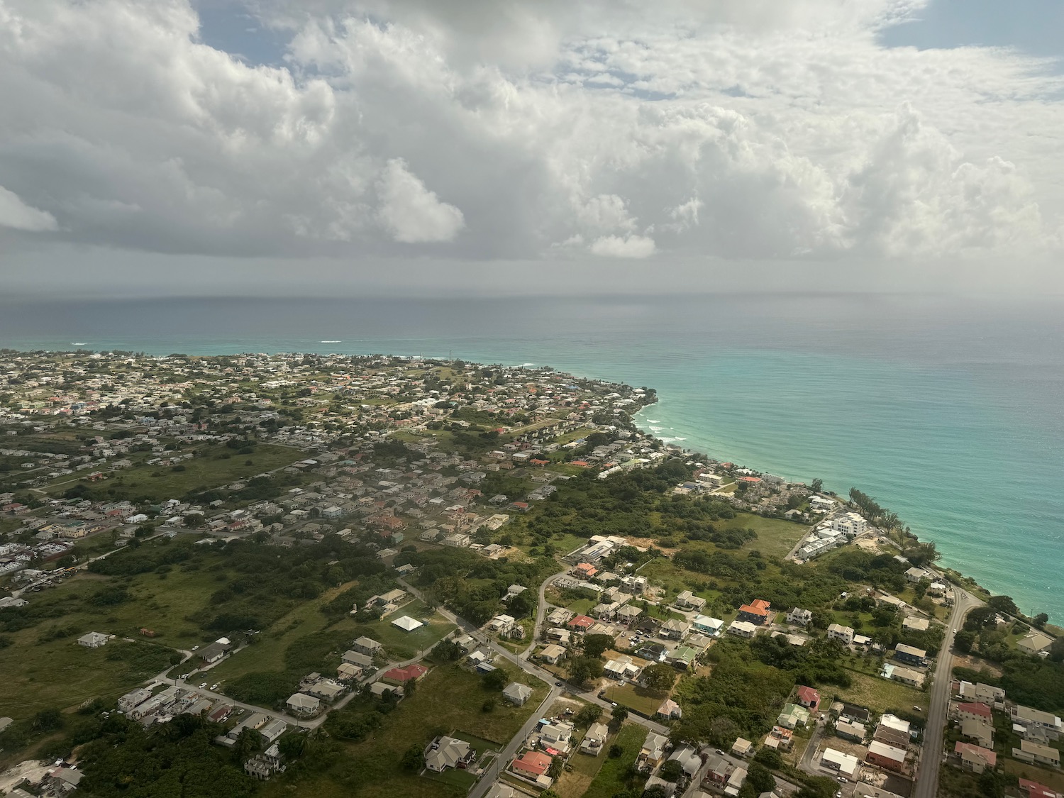 a aerial view of a city by the ocean