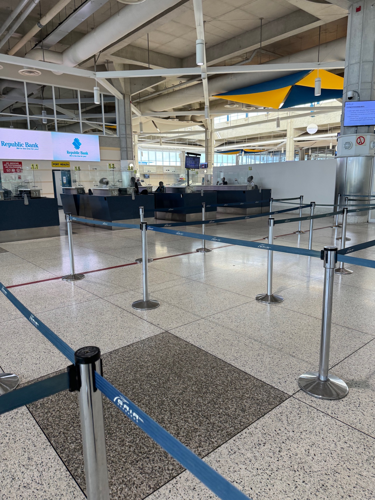 a check in area with blue barriers