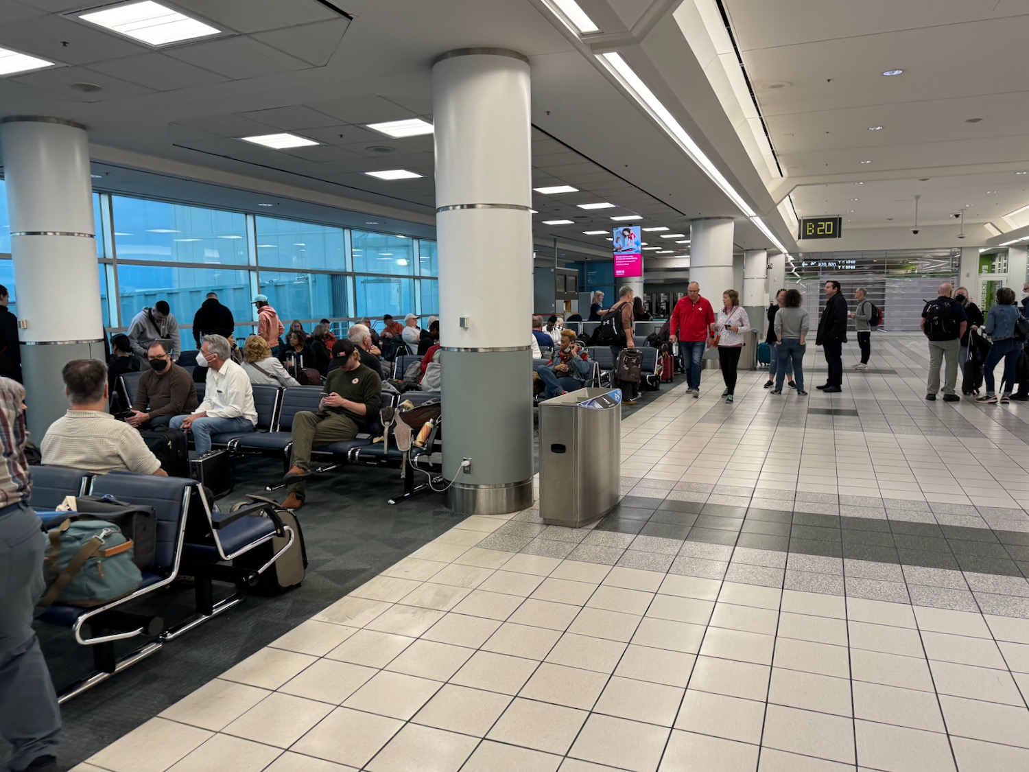 a group of people in an airport terminal