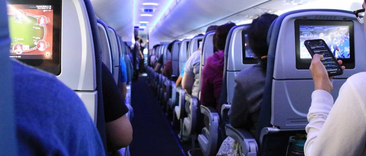 a group of people sitting in an airplane
