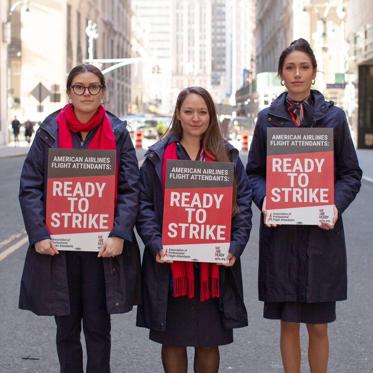 a group of women holding signs