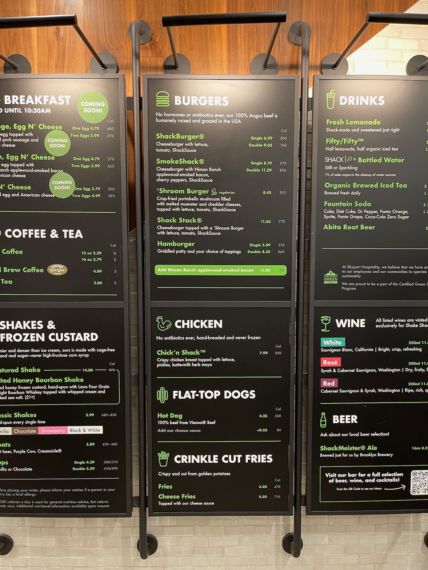 a menu board with green and white text