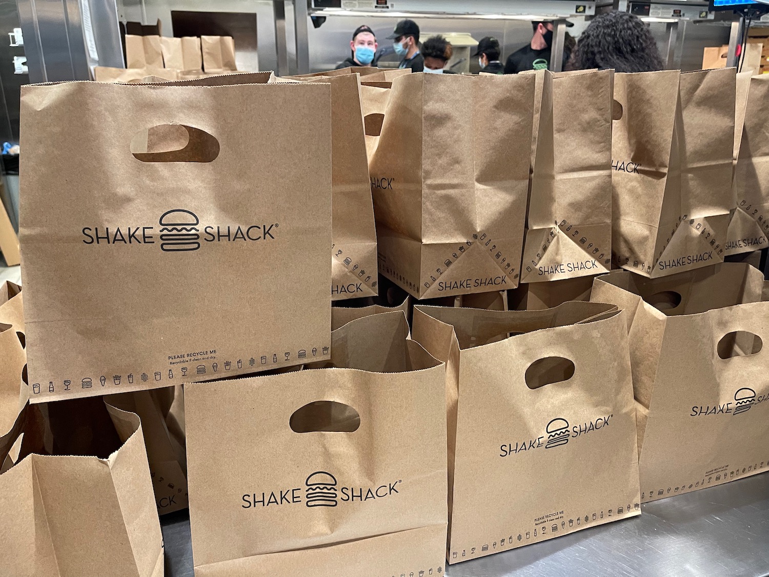a group of brown bags with black text