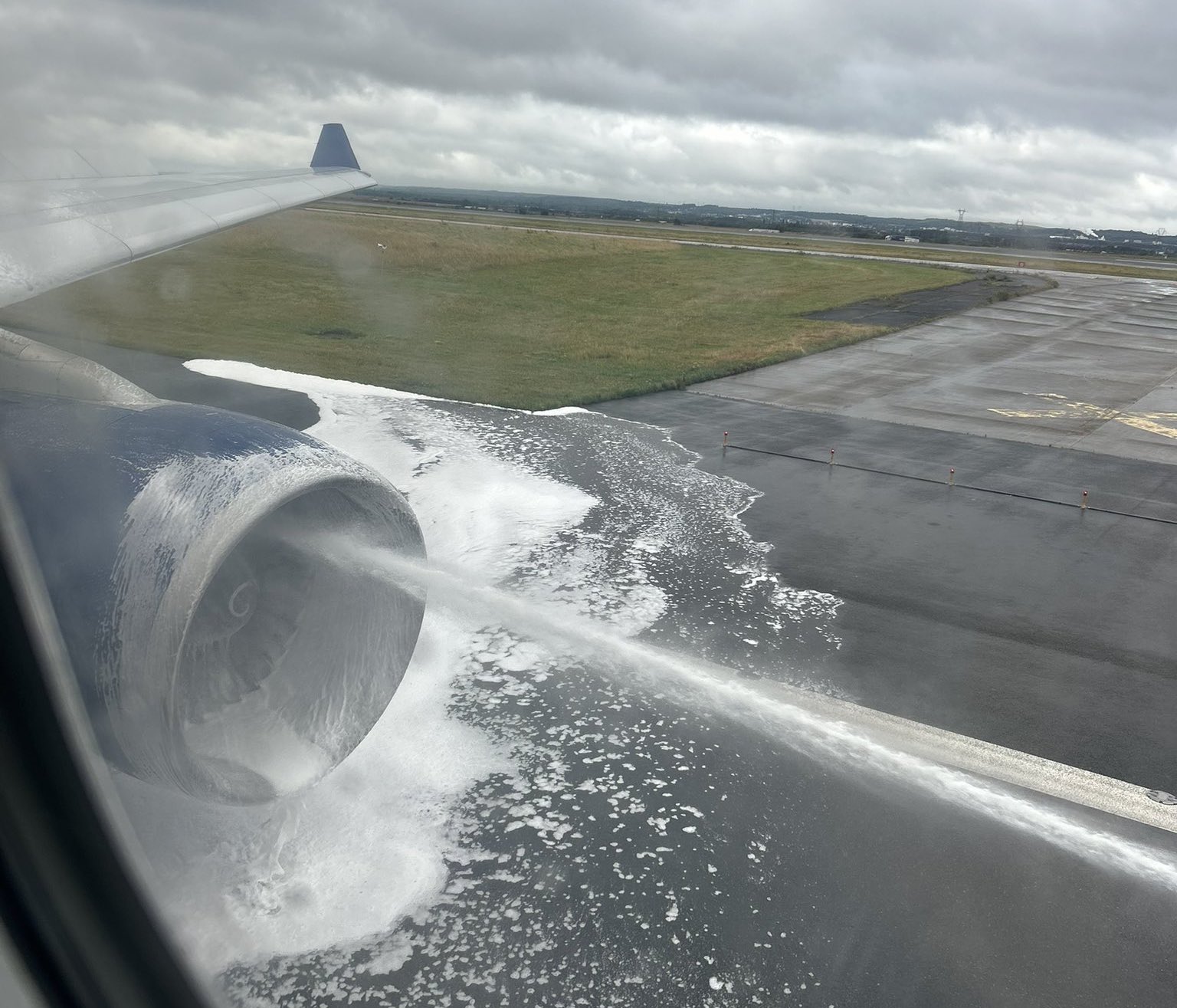 jet engine spraying water on a runway