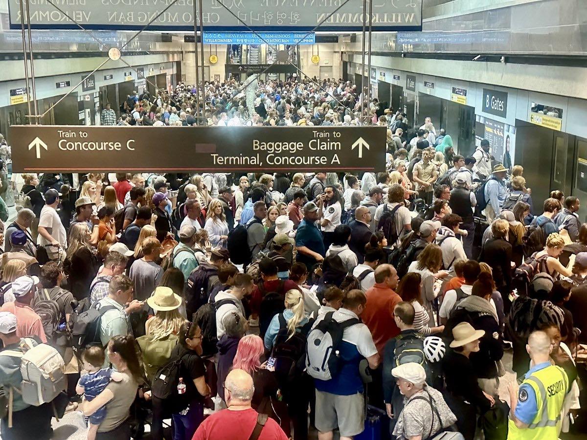 a crowd of people in a terminal