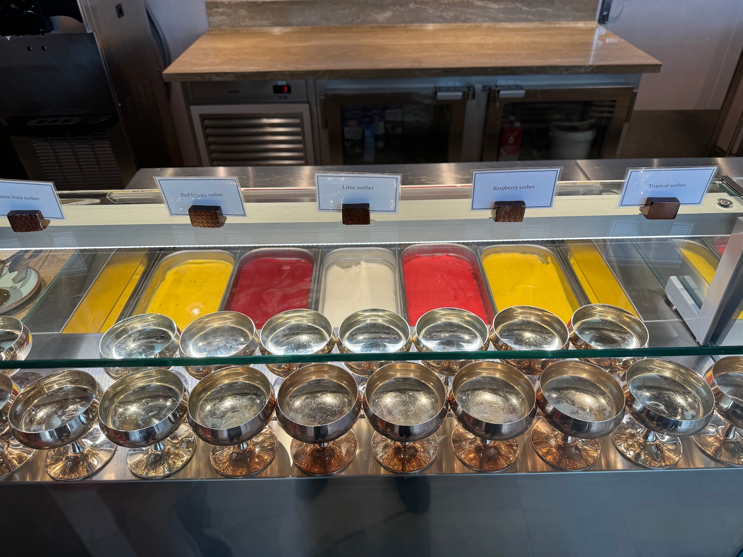 a display case with different colored gelatos