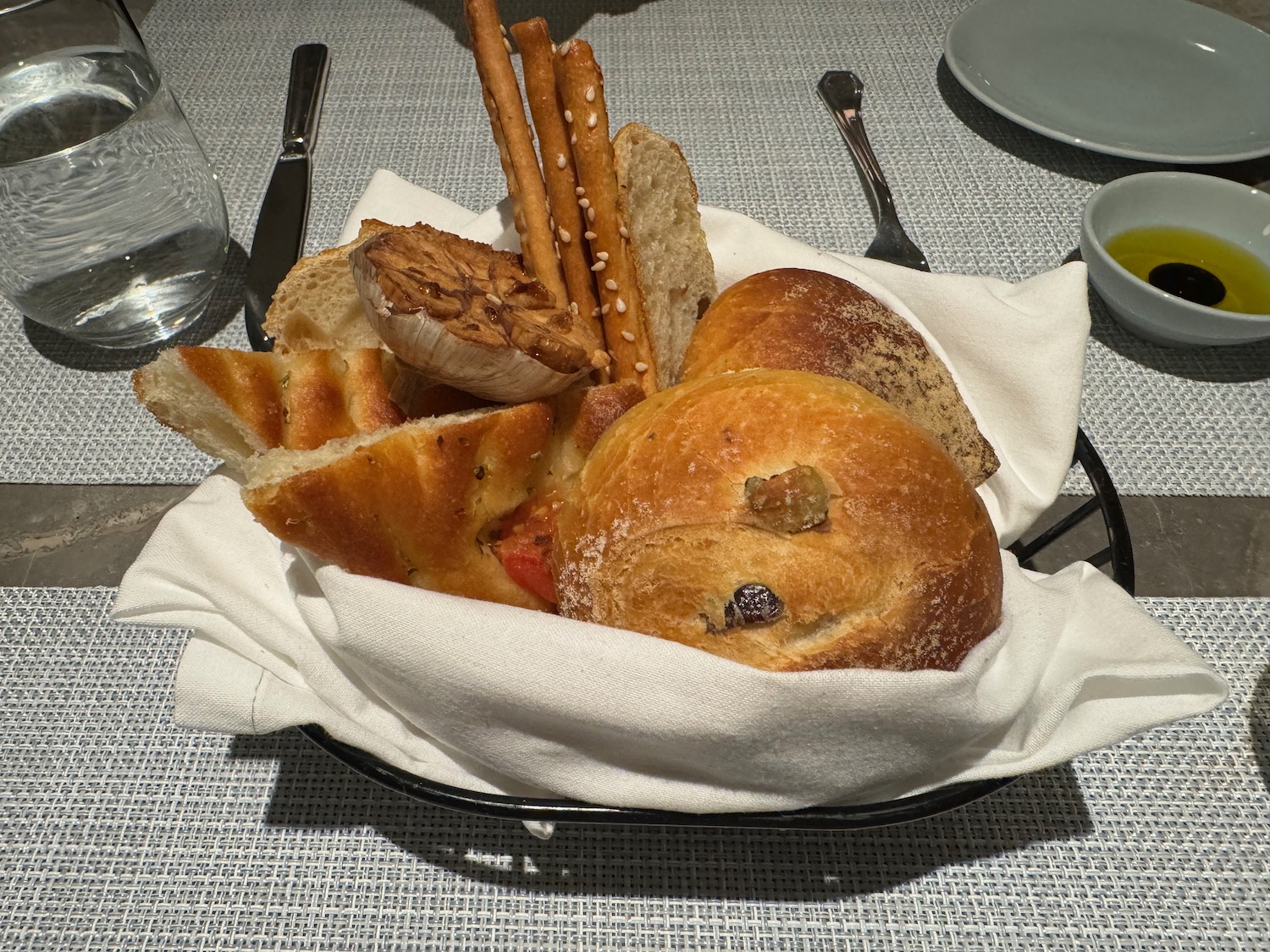 a plate of bread and pretzels