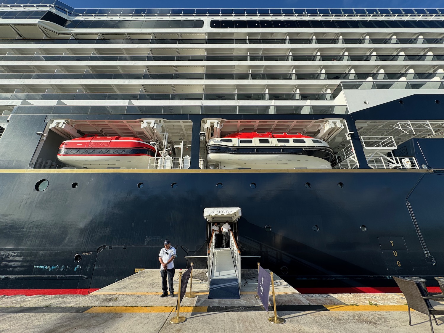 a man standing in front of a large ship