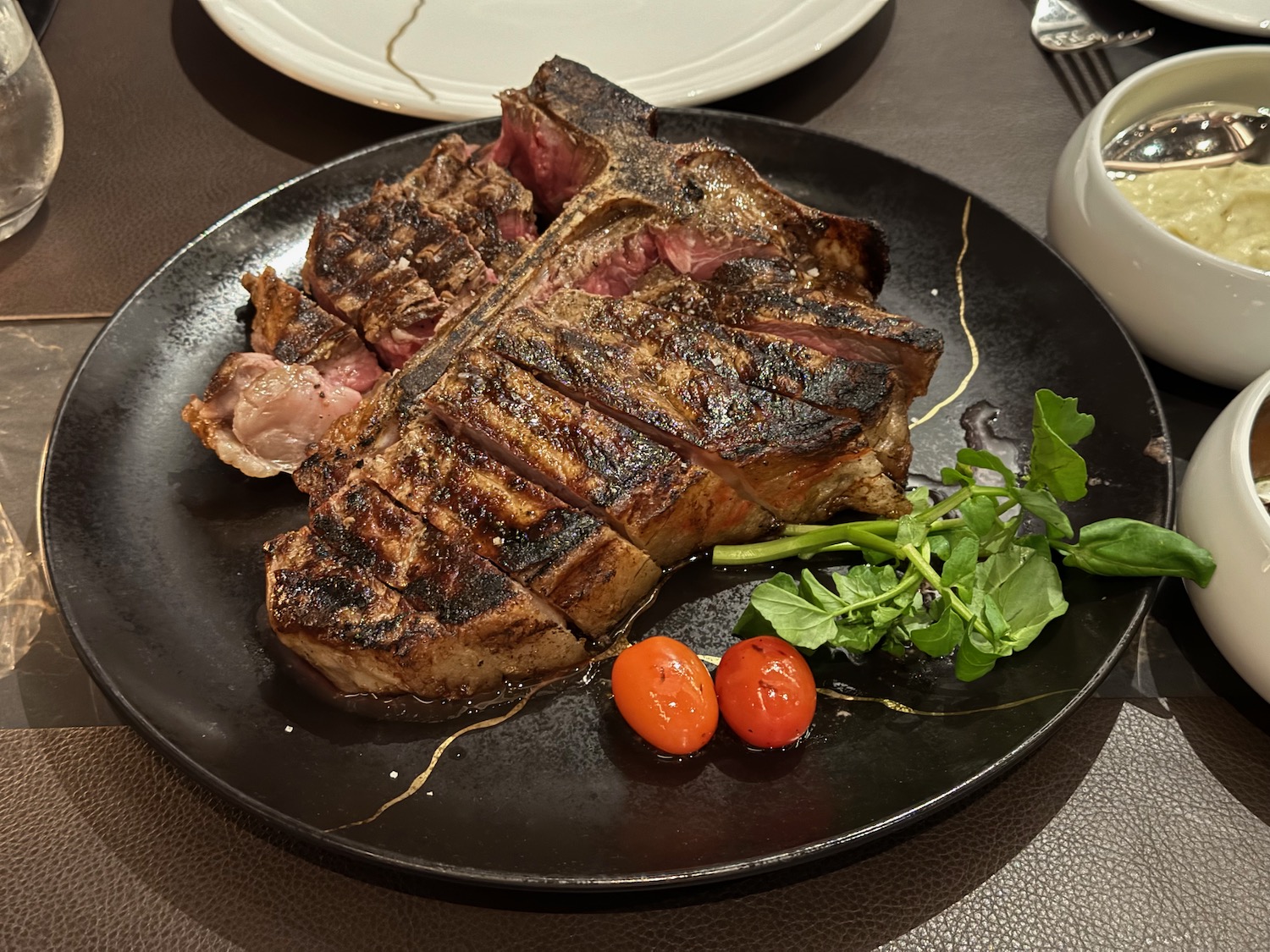 a plate of steak and vegetables