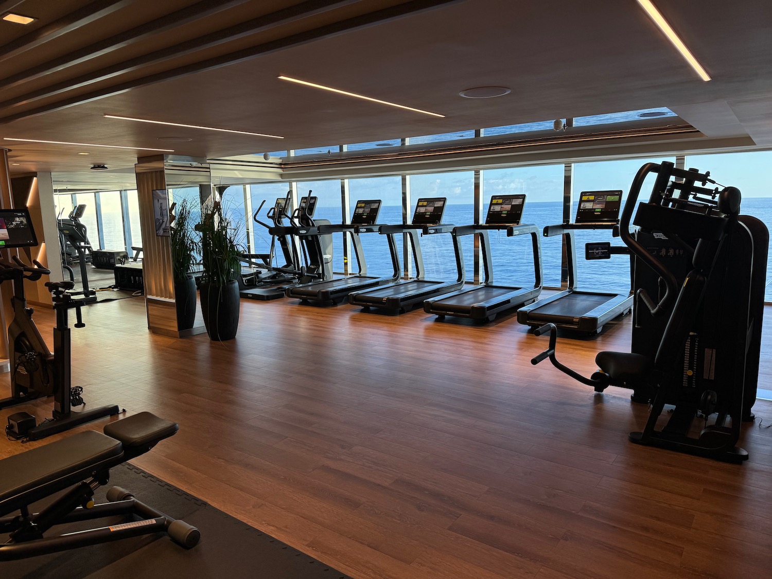 a large room with treadmills and exercise equipment