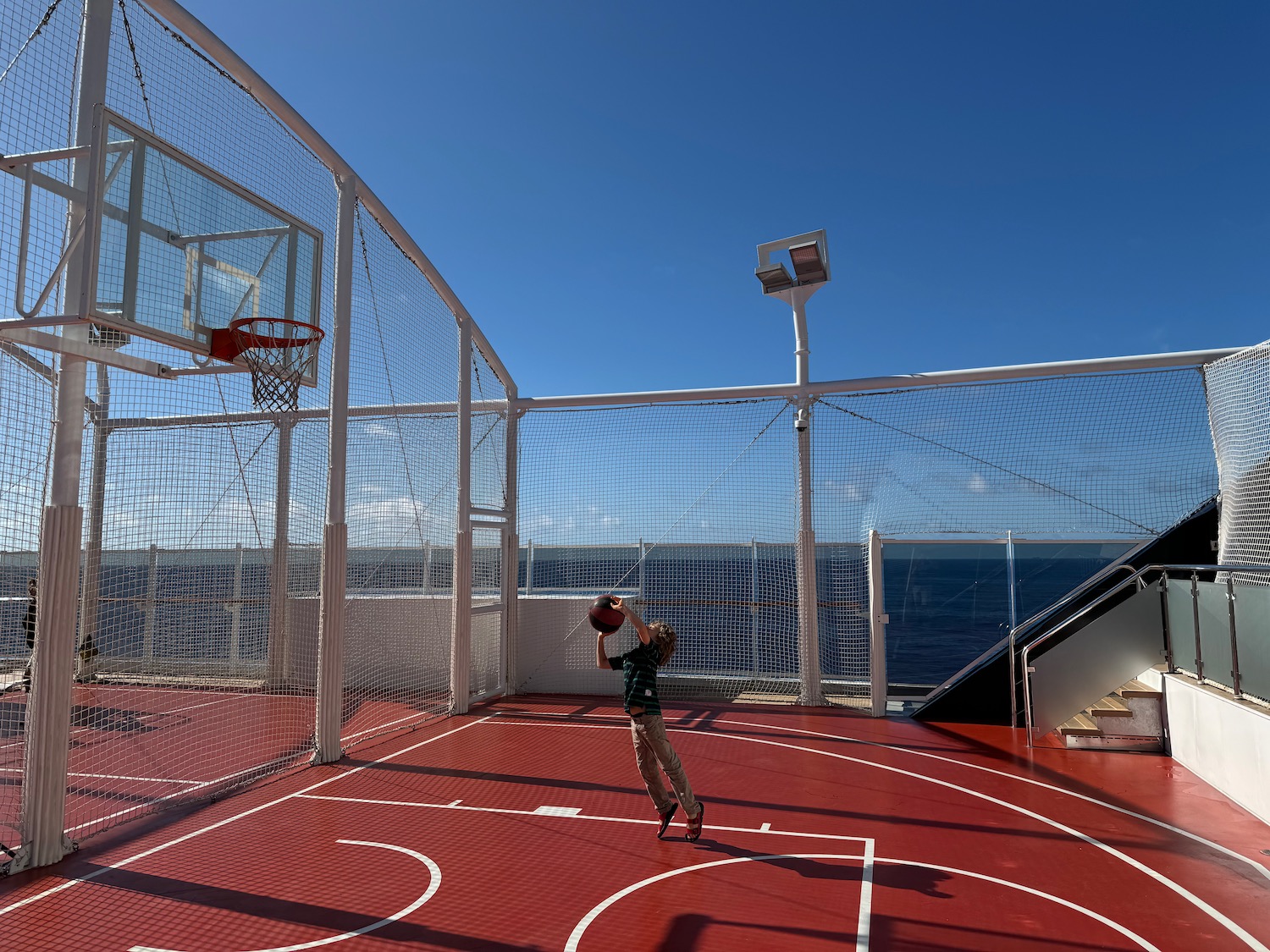 a person playing basketball on a ship